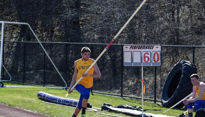Tim Berry races down runway prior to pole vault attempt