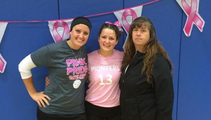 Lera Braun with her mother Lora and her sister Laina after the 2014 Pink Pride Game