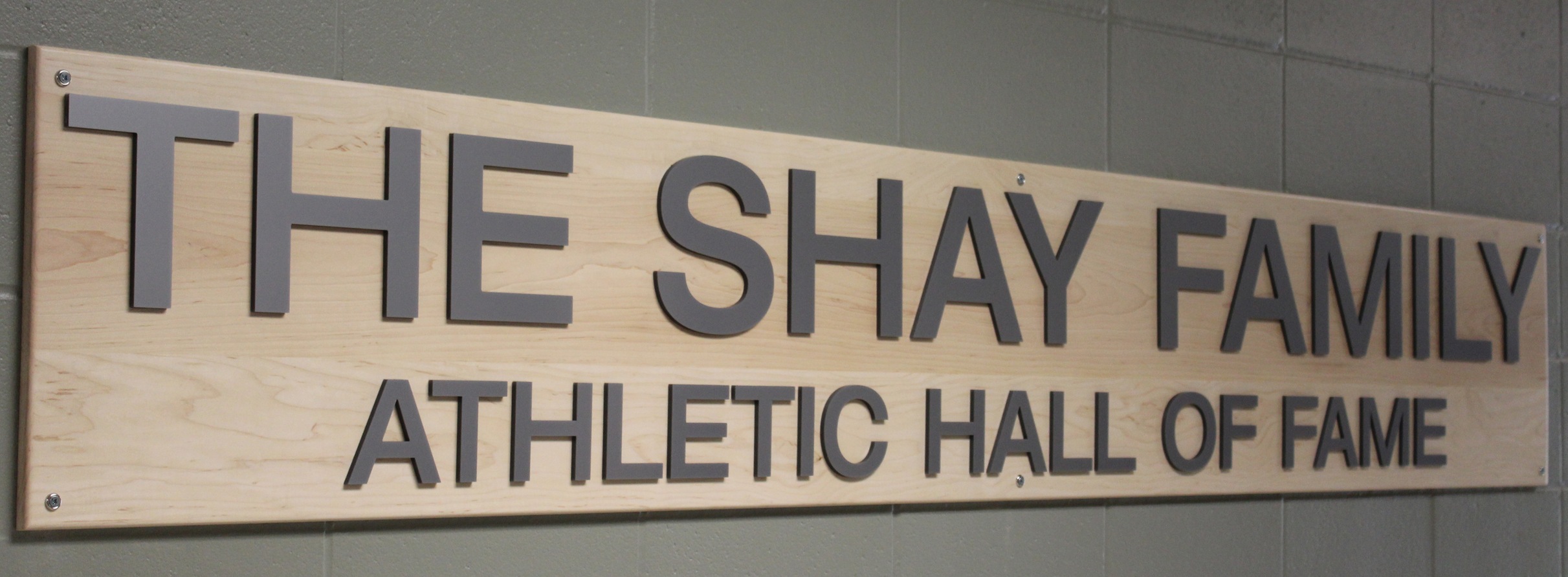 The Shay Family Athletic Hall of Fame Plaques outside the room