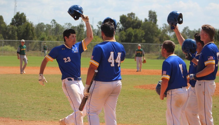 Matteo Avallone celebrates with teammates after hitting a grand slam