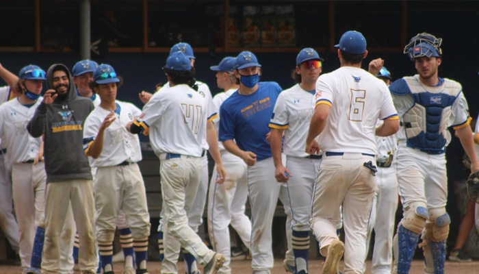 Pioneers celebrate after getting the final out of an inning