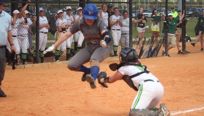 Audrey Farrell with the leap over the catcher's glove