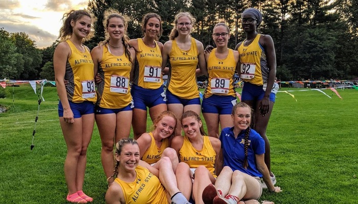 Cross country team poses at St. John Fisher Invitational